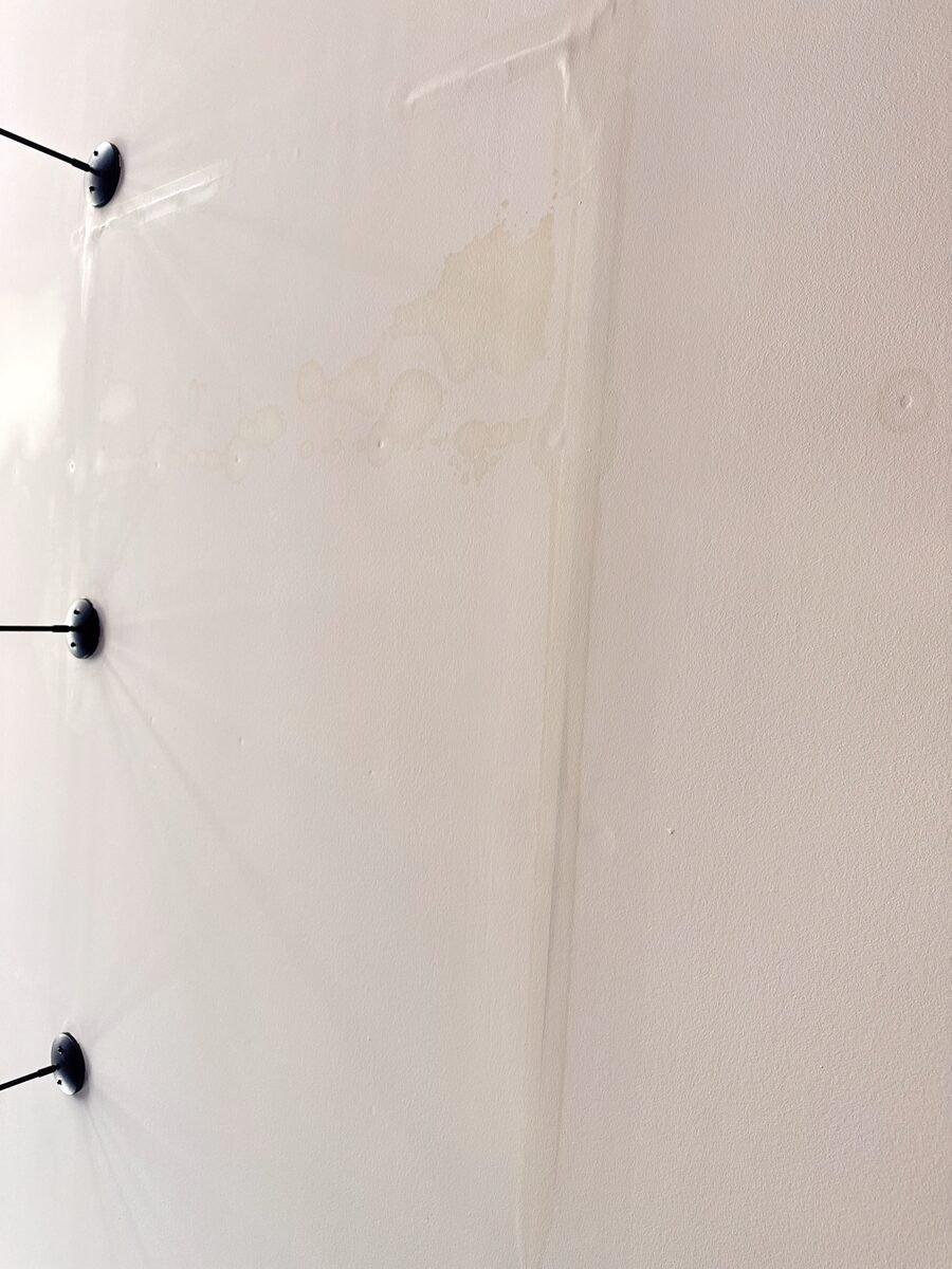 Discoloration on an interior ceiling near lighting fixtures